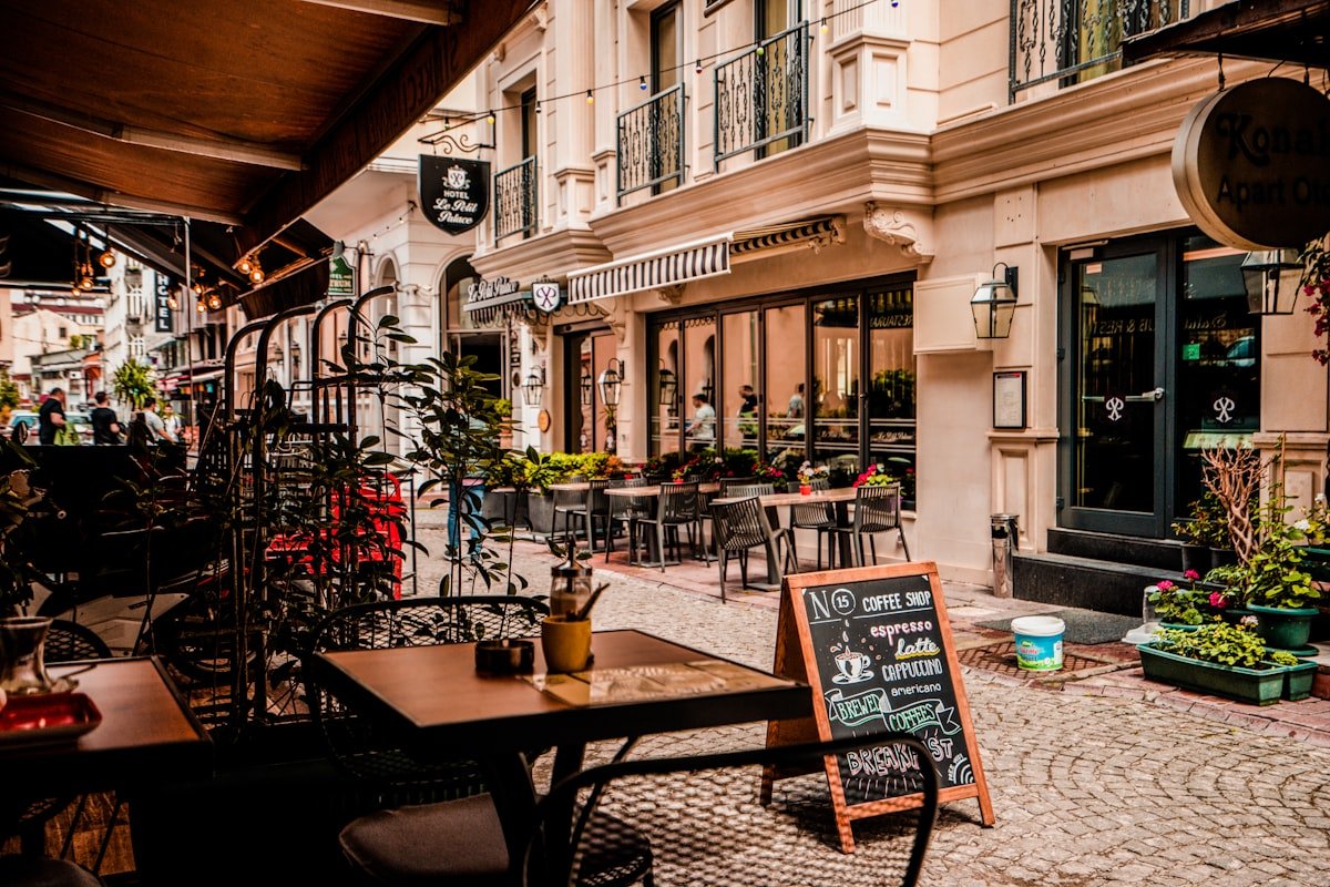 Outdoor café seating on a sunny Portland street