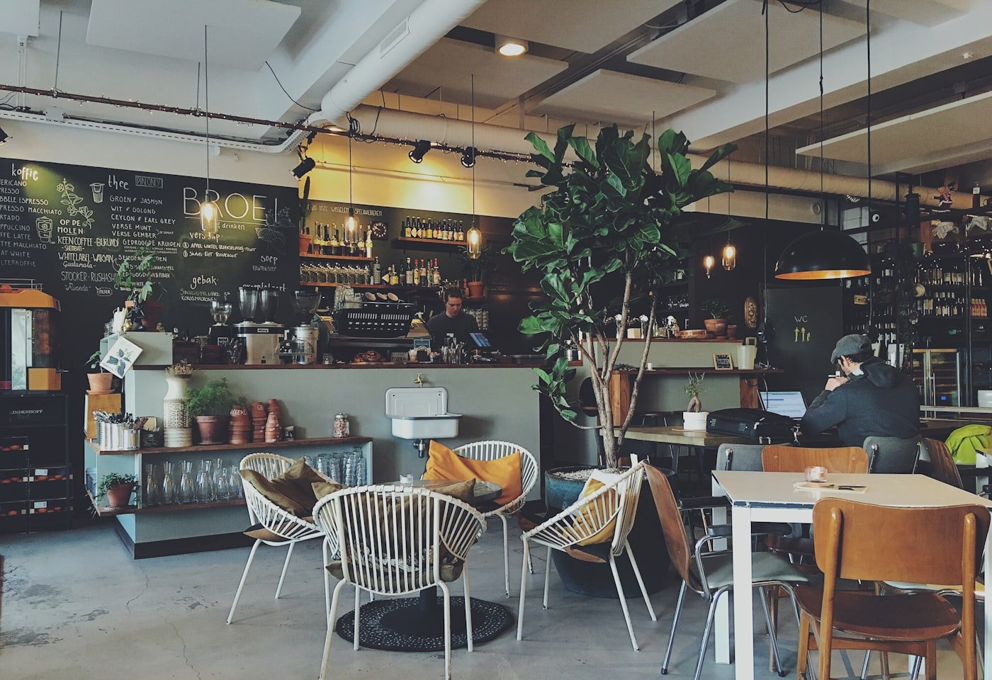 Harbor Oak café storefront on Alberta Street with warm interior light